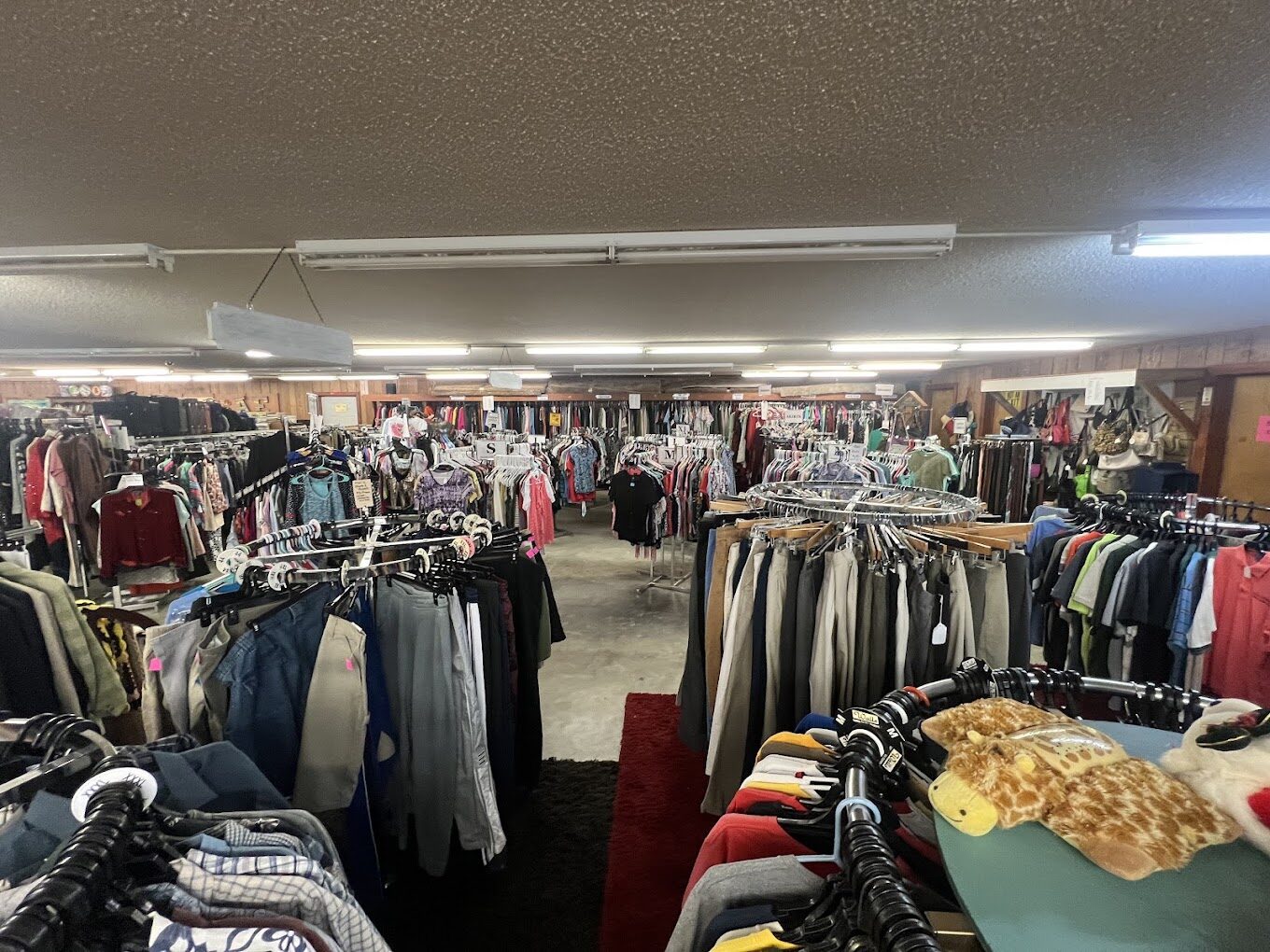 Racks of clothing at the Funny Farm Thrift Store